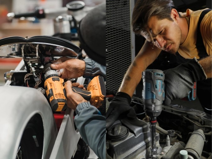 Mechanics using cordless impact wrenches to repair a car