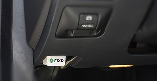 Fixd OBD-II Adapter plugged into car's OBD-II port