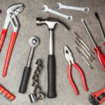 Essential tools for your car in a tool kit. A well-organized car tool kit containing socket set, wrenches, screwdrivers, pliers and more for vehicle maintenance and emergency repairs.