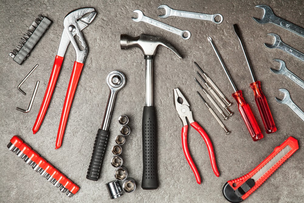 Essential tools for your car in a tool kit. A well-organized car tool kit containing socket set, wrenches, screwdrivers, pliers and more for vehicle maintenance and emergency repairs.