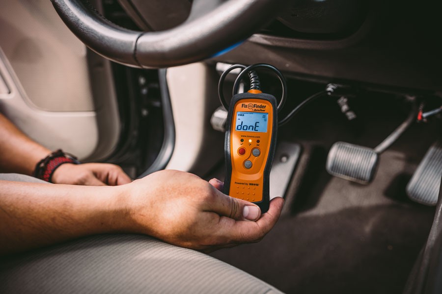 OBD2 port location under the dashboard