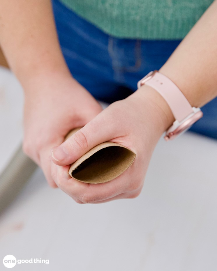 Attaching cardboard tube to vacuum hose