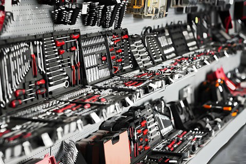 Car maintenance tools laid out on a workbench.