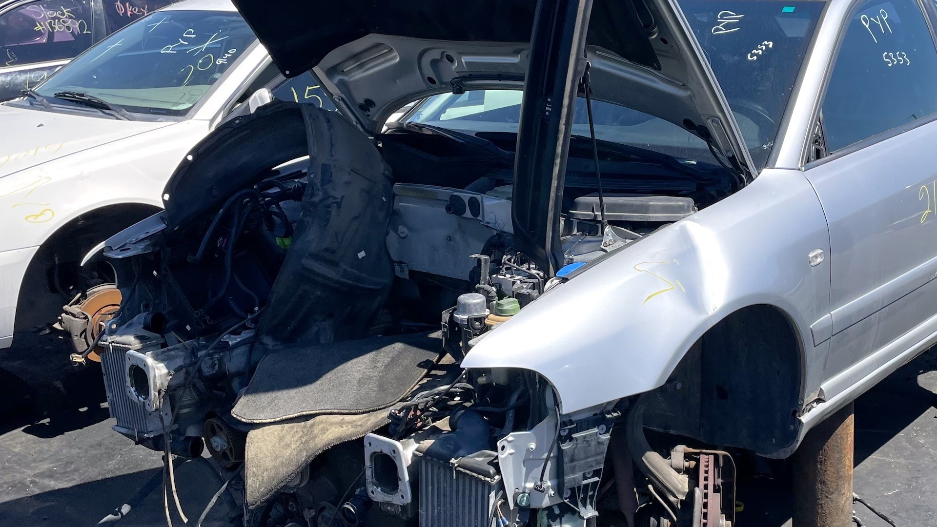 alt text: A close-up of a car dent being repaired with a tool from the Anyyion 92-piece kit.