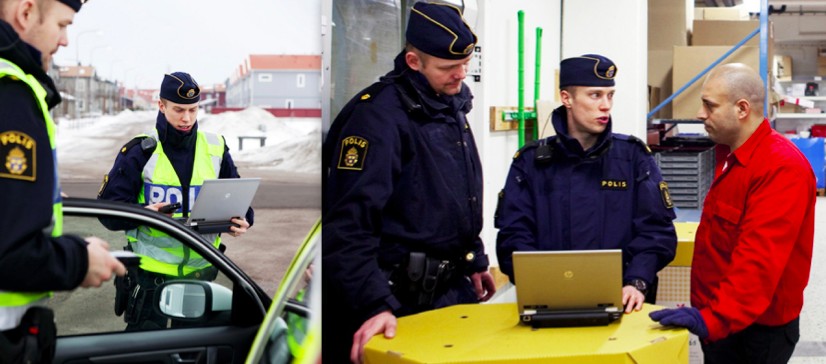 alt text: A police officer standing next to a police car